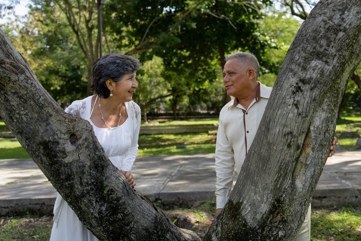 Retirees laughing together on a hiking trail — ideas for things to do in retirement